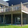 A completed deck on a brick home using Metwood Deck Brackets designed especially for brick