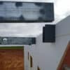 Image of a beam being placed into a ICF Beam Hanger for Suspended Concrete Floor Systems by Metwood Building Solutions.